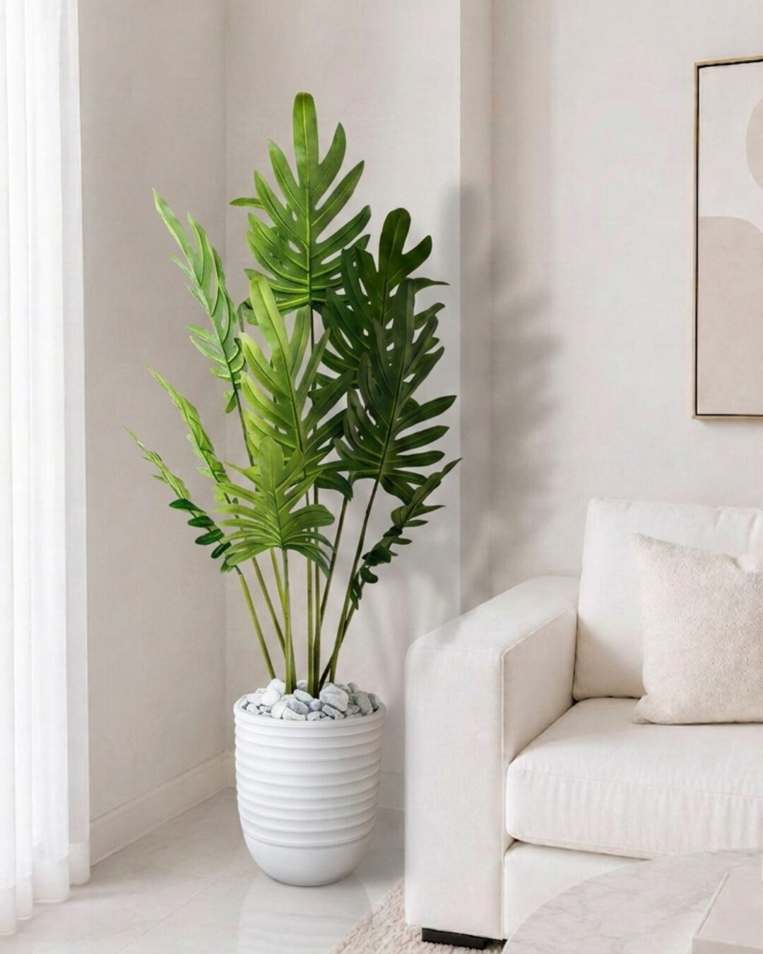 Sublimez votre intérieur avec ce Philodendron Xanadu artificiel de 1,60 m. Livré dans un magnifique pot en céramique blanc strié. Prix : 139 DT seulement.